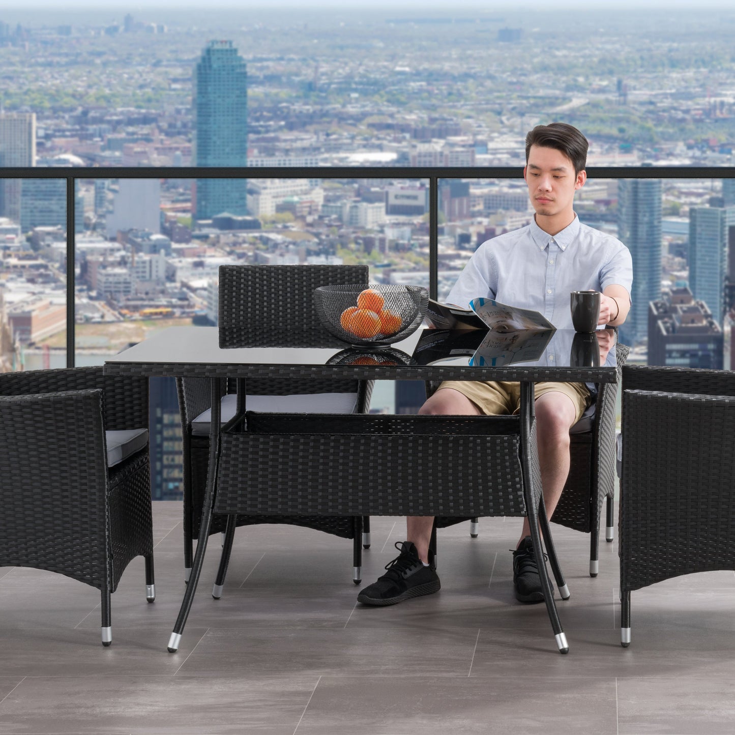 Black outdoor dining table with sleek aluminum frame, tempered glass top, and weather-resistant finish, ideal for patio or garden use. Rectangular shape with modern design, perfect for outdoor dining and entertaining.