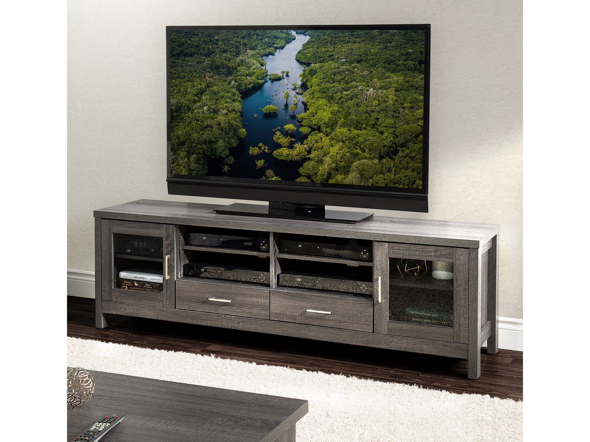 Grey wood TV stand for TVs up to 80 inches with a sleek, modern design, featuring open shelving, two cabinets with black handles, and a sturdy construction perfect for contemporary living rooms.