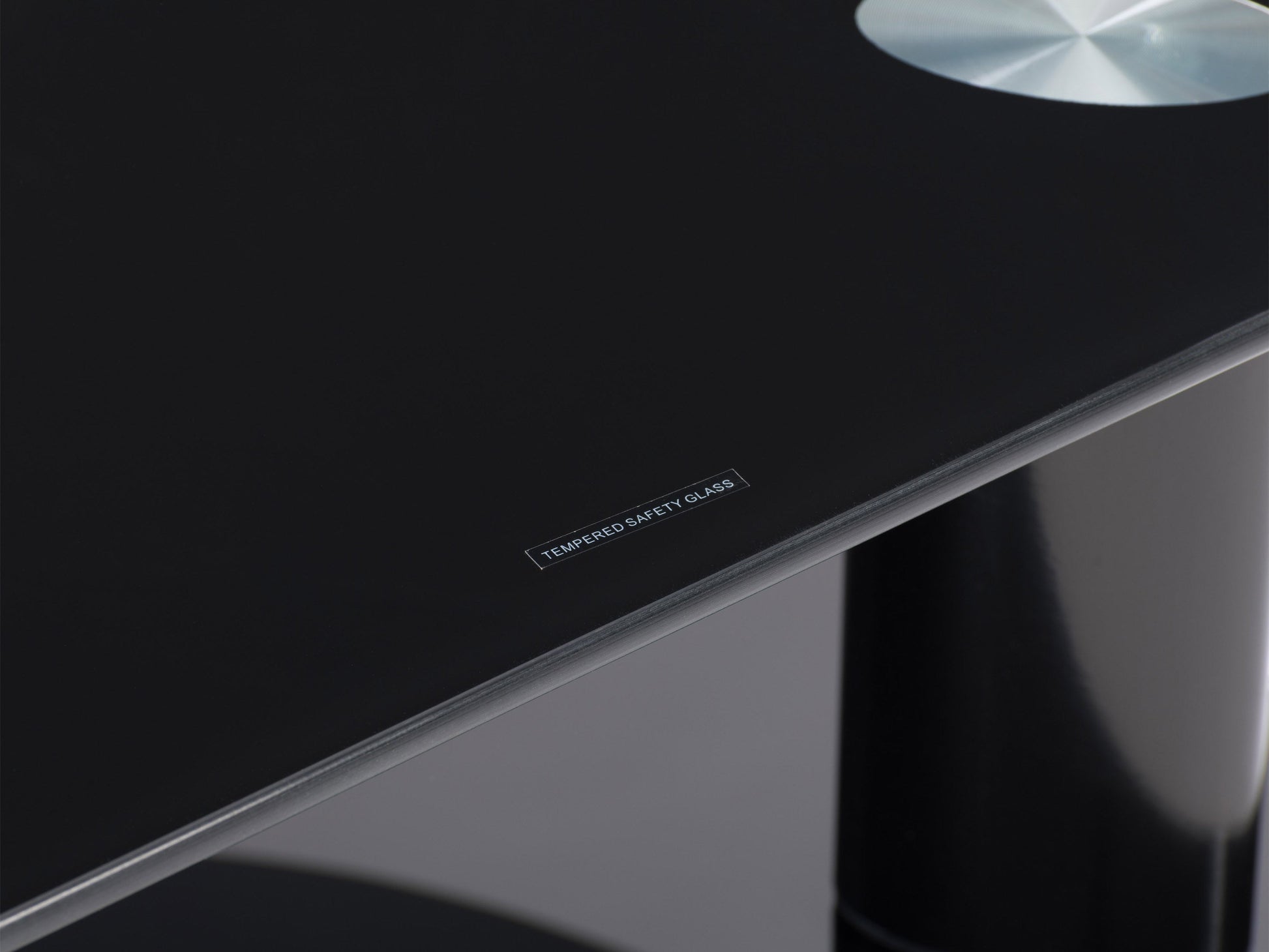 Modern glass TV stand for TVs up to 65 inches, featuring a sleek black frame, tempered glass shelves, and a minimalist design ideal for contemporary living rooms.