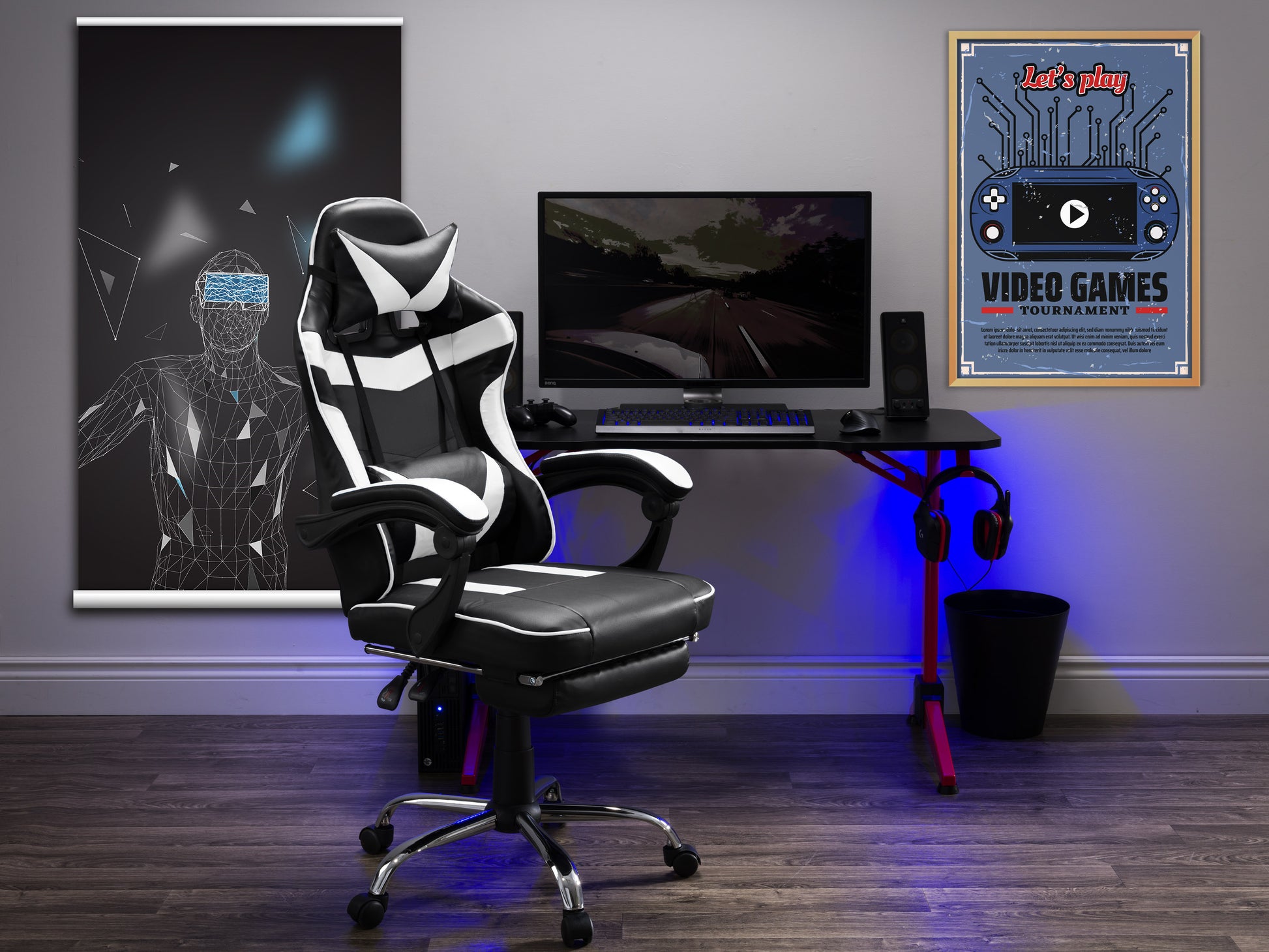 Black and red gaming chair with footrest, ergonomic design, padded armrests, high backrest, adjustable height, and lumbar support, made with breathable PU leather and mesh fabric, ideal for gamers and office use.